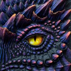 a close up of an eye on a dragon's head