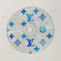 a cd with blue and white designs on it