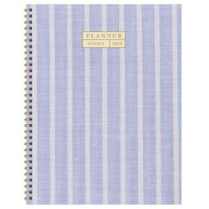 a blue and white striped planner with the word planner written in gold foil on it