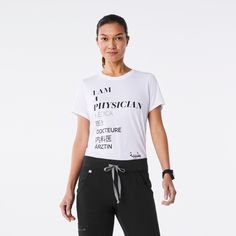 a woman is standing in front of a white background wearing black pants and a t - shirt with the words i am physically written on it