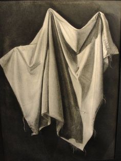 a black and white photo of a cloth draped on top of another piece of cloth