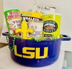 a blue bowl filled with snacks and condiments