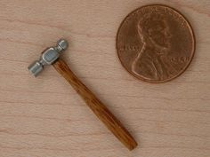 a hammer and a penny on a table