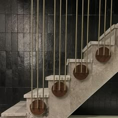 a set of marble stairs with metal handrails and brown circles on the steps