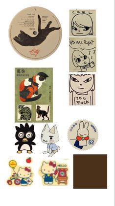 various stickers and magnets are arranged on a white surface, including an image of cats