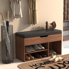 a wooden bench with shoes and umbrellas on it in front of a wall mounted coat rack