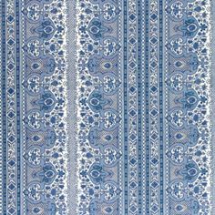 a blue and white striped wallpaper with an ornate design on it's side