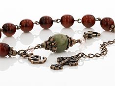 Artisan Collection of Ireland™ 11mm round Connemara marble with 8mm round brown glass beads and 4x4mm fancy white glass bead, bronze tone over brass Irish rosary bracelet. Measures approximately 3/8"W. 1 1/2" extender. Lobster clasp. Bronze Rosary With Round Beads As Gift, Bronze Rosary As Gift, Brown 8mm Beads For Jewelry Making, Spiritual Brown Rosary Bracelet With Beads, Brown Spacer Beads Jewelry Gift, Nickel-free Brown Spiritual Beaded Bracelets, Brown Nickel-free Spiritual Beaded Bracelets, Irish Symbols, Connemara Marble