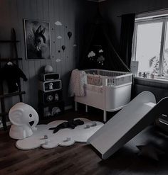 a child's room with toys and furniture in it, including a slide that looks like an elephant