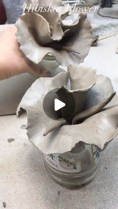 two flowers are being made out of clay