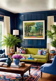 a living room with blue walls and green couches, potted plants and paintings on the wall