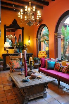 a living room filled with furniture and a chandelier