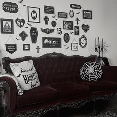 a living room filled with furniture and pictures on the wall