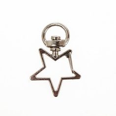 a silver metal keychain with a star on it's side and an arrow in the middle