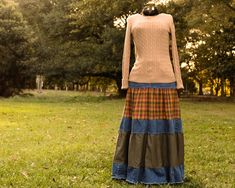 🍂 Embrace the coziness of the autumn season with an upcycled tiered skirt! With rich, warm colors reflecting the splendor and changing colors of autumn, this cozy, boho tiered skirt combines the comfort of jeans with the classy style of a skirt.  🤎 Colorful tiers add a graceful flow and whimsical addition to any outfit. Pair it with a simple t-shirt, or pull out a sweater or hoodie for full-out cozy charm! 🪡 This skirt is made-to-order, ensuring the perfect fit to you and your closet. Let me know your waist size as well as how long you want your skirt to be. Then from the drop down menus, select your choice of autumn-inspired prints (see the photos above for options), as well as your preferred hem finish --traditional hem, a lace hem, or a frayed hem. All fabrics (excluding denim) are 1 American Hairstyles, Cozy Boho, Autumn Inspired, Colors Of Autumn, Patchwork Skirt, Simple T Shirt, Upcycle Jeans, African American Hairstyles, Simple Tshirt