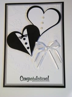 a congratulations card with two hearts and a tuxedo