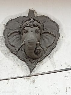 an elephant head on the side of a building