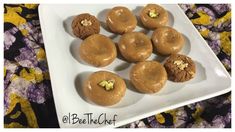 chocolate donuts with peanut butter and walnuts on a white plate