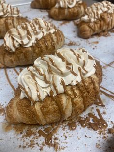 baked goods with white frosting and drizzled on them