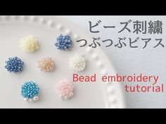 bead embellishments on a white plate with japanese writing in the background