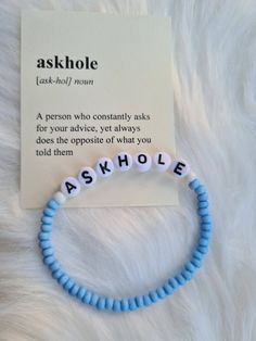 a bracelet with the word askhole written on it