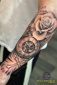 a man's arm with a rose and an old pocket watch tattoo on it