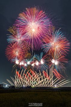 fireworks are lit up in the night sky with long exposures to show them off