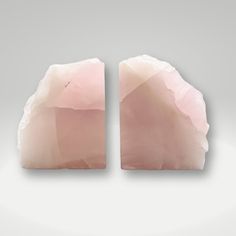 two pieces of pink rock sitting on top of each other