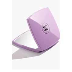 a compact mirror with the letter c on it's front and bottom corner in purple