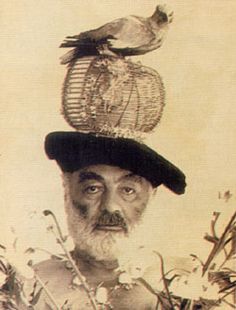 an old man with a bird on top of his head