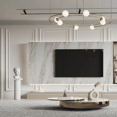 an elegant living room with marble walls and white furniture, including a large television on the wall