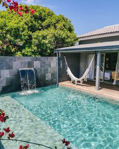 a pool with a hammock in the middle