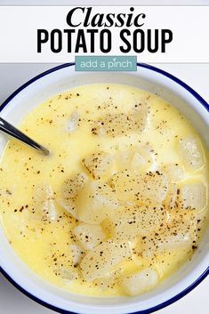 a bowl of potato soup with a spoon in it