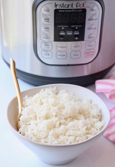 rice in a bowl next to an instant pot