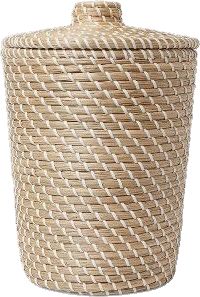 a large woven basket with white handles