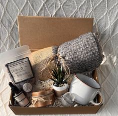 an open box containing coffee, tea and other items