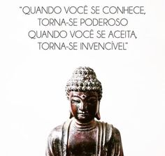 a buddha statue sitting on top of a wooden table next to a quote from the pope