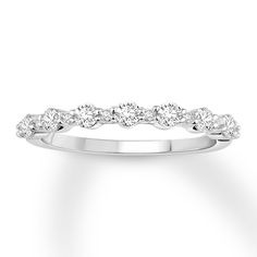 a white gold wedding band with five diamonds