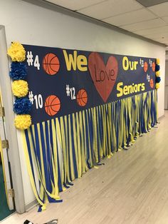 a wall decorated with basketball decorations and streamers