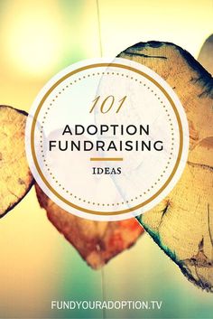 a wooden heart hanging from the ceiling with text overlay reading 101 adoption fundraiser ideas