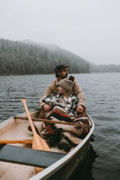 a man and child are in a boat on the water