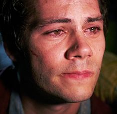 a close up of a person with blood on his face