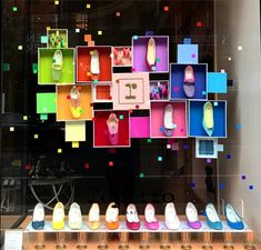 there are many pairs of shoes on display in the window