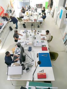 people sitting at desks in an office setting