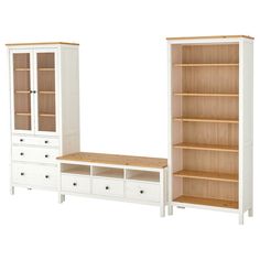 a white dresser and bookcase next to each other with drawers on the bottom shelf