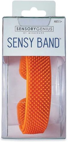 an orange hair brush in a package on a white background with the words sensory band