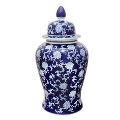 a blue and white vase with a lid on it's side, sitting against a white background