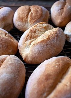 several loaves of bread sitting on a cooling rack