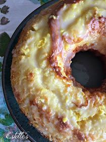 a glazed doughnut sitting on top of a pan covered in icing and toppings