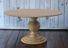 a wooden table sitting on top of a hard wood floor